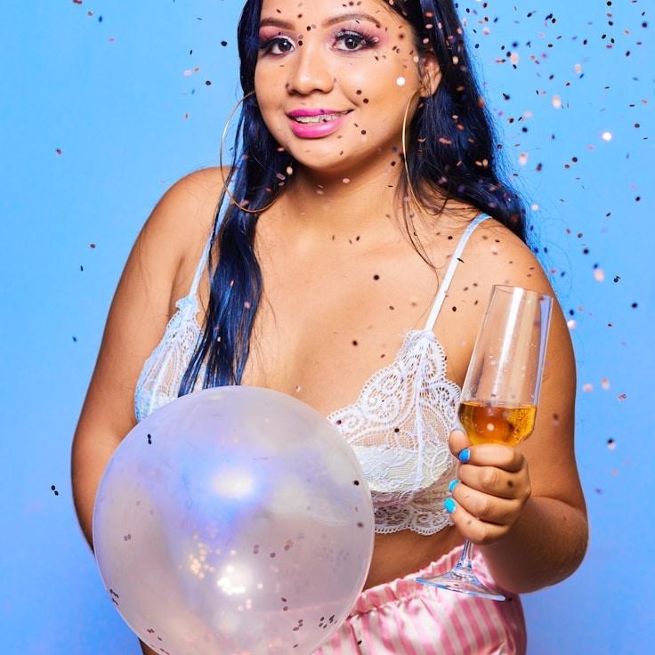 Avery Chen, Lead Design Curator at GreenStellarMarket, reviewing corporate floral arrangements